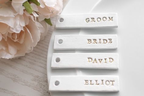 Wedding Name Place Settings and Favours for Rustic wedding table décor. Personalised Clay gift tags Clay Place Names, Clay Name Tags, Gold Themed Wedding, Name Place Settings, Wedding Name Tags, Clay Gift Tags, Rustic Wedding Table Decor, Wedding Place Names, Eco Friendly Gift Wrapping