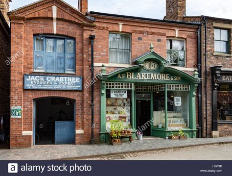 Download this stock image: The Grocer's Shop and Cycle Showroom at the Blists Hill Victorian Town, near Madeley, Shropshire, England, UK. - J19F9P from Alamy's library of millions of high resolution stock photos, illustrations and vectors. Victorian Town, Siam Discovery, Store Front Windows, English Architecture, Motorcycle Shop, Shop Fronts, Shop Front, Grocery Shop, Store Fronts