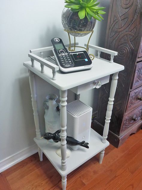 I purchased a little vintage telephone table to house our landline telephone and modem. It functioned perfectly for our needs, albeit a little drab and worn looking. But my biggest issue was all those visible cables!! So I decided to give it a little makeover.    The first thing I did was look around my garage for something to attach to the back. I found an old cabinet back panel that would be perfect! (And if I didn’t have one on hand, I’m sure these are inexpensive to buy.… Telephone Table Makeover, Vintage Telephone Table, Dry Brush Painting, Phone Table, Pipe Table, Pallet Garden Furniture, Diy Planter Box, Telephone Table, Diy Entryway