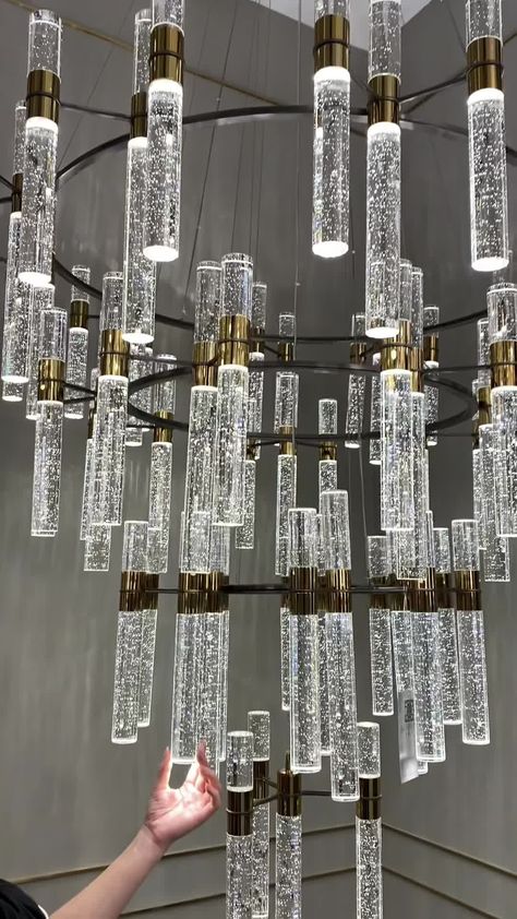 This Oversized Modern Luxury 4-tiered Bubble Crystal Icicle Chandelier is designed for high-ceiling foyers, hallways, and staircases. Its four-tiered design combines clear crystal, bubble crystal, icicle crystal, and a gold finish for a stunning look. Expertly crafted, this designer-recommended fixture provides both creative style and illumination. Voltage 110V-120V/ 220V-240V Material Crystals, Metal Wire Length Adjustable Light Source LED Bulb Included Or Not Yes Dimmable Yes Sloped Ceiling Ad Icicle Chandelier, High Ceiling Chandelier, High Ceiling Foyer, Hallway Staircase, Ball Room, Foyer Hallway, Elegant Lighting Fixtures, Chandelier Art, Bubble Chandelier