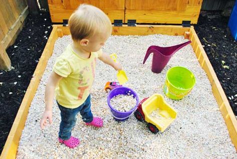 Switching from sand to a rock box with pea gravel... Might be easier to contain and deal with in the wet winter though harder to mold. Sandbox Alternative, Build A Sandbox, Sandbox Cover, Rock Box, Indoor Playhouse, Build A Playhouse, Young House, Sand Play, Young House Love