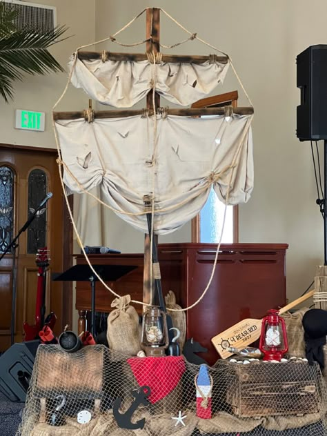 Nautical/pirate theme! Kids church service! Christian Pirate Theme, Boat Stage Prop Set Design, Pirate Sail Diy, Pirate Ship Mast Diy, Pirate Theme Vbs, Pirate Photo Booth, Pirate Wreath, Cardboard Pirate Ship, Pirate Halloween Decorations