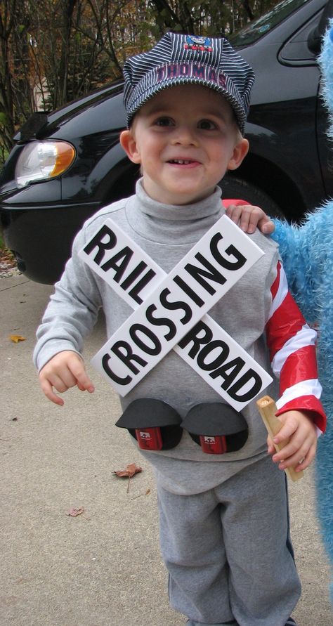 Railroad crossing signal costume for my son, complete with working flashing lights! Railroad Costume Ideas, Diy Conductor Costume, Street Sign Halloween Costume, Railroad Crossing Costume, Adult Train Costume, Train Stroller Costume, Train Conductor Costume Adult, Train Halloween Costume Toddler, Train Engineer Costume