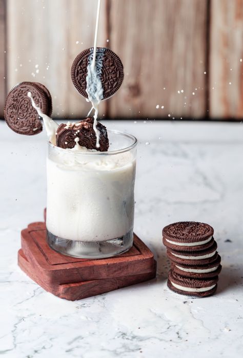 Oreos flying to glass of milk Cookie And Milk Photoshoot, Milk And Cookies Photo Shoot, Cookie Dough Photography, Milk And Cookies Photography, Oreo Biscuits Photography, Oreo Milkshake Photography, Monthly Prompts, Cookies And Milk, Milk And Cookies