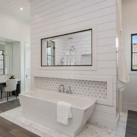 Shiplap feature wall helps make the tub the focal point of this space. Featuring WindsorONE shiplap boards. credit: Woods Architecture LLC & Seven Development Read more about this project here. Tub In Front Of Shower Wall, Bad Skincare, Shiplap Bathroom Wall, Floating Tub, Shiplap Feature Wall, Bathroom Feature Wall, Shiplap Boards, Shiplap Bathroom, Master Bath Shower