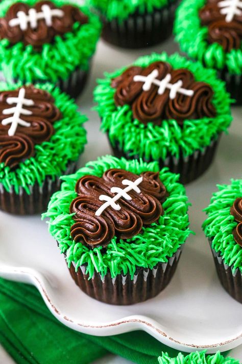 It's officially football season, so it's time to learn how to make these easy football cupcakes! A delicious cupcake is topped with green buttercream grass and a chocolate buttercream football, complete with white laces! Perfect for football watching, parties or a Super Bowl party! Football Cupcake Cakes, Super Bowl Cupcake, Homemade Chocolate Cupcakes, Football Cupcakes, Game Day Football, Football Cake, Cake And Cupcakes, Decorating Cakes, Cake Making