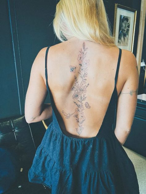 Spine Tatoos Woman Flower, Spinal Tattoo Floral, Growth Spine Tattoo, Spine Book Tattoo, Women’s Back Tattoos Spine Flowers, Punchy Spine Tattoo, Floral Spinal Tattoo Women, Hummingbird Spine Tattoo, Bee Spine Tattoo