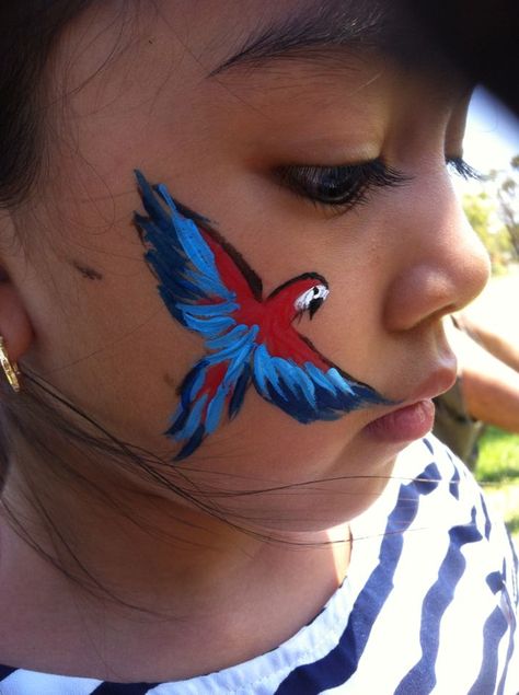 Parrot face paintbirdcolourfulGabbas Face Painting Parrot Face Painting, Jungle Face Paint, Face Painting Easy Simple, Tropical Face Paint, Animal Face Paint Ideas For Kids, Face Painting Animals, Parrot Face Paint, Easy Animal Face Paint, Bird Face Painting