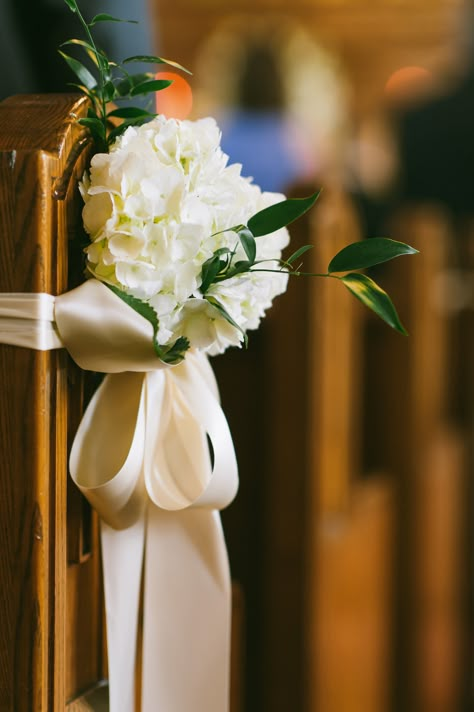 Double face satin bows dressed with white hydrangea and italian ruscus adorn church pews to add the perfect subtle touch to the church. Stapleton Floral Design | Briana Moore Photography | Boston Florist | Wedding Florist | Custom Floral Design Church Pew Decorations, Wedding Pew Decorations, Pew Markers, Pew Flowers, Wedding Church Decor, Pink Green Wedding, Pew Decorations, Wedding Pews, Church Wedding Flowers