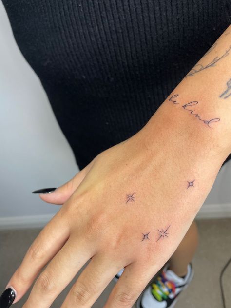 Manifest Hand Tattoo, Kenzie Ziegler Hand Tattoo, Hand Star Tattoo, Hand Sparkle Tattoo, Star Hand Tattoos, Group Tattoo Ideas, Dainty Hand Tattoos, Finger Tattoos Words, Aesthetic Tattoo Ideas