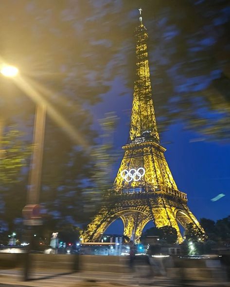 the olympic rings have been installed on the eiffel tower for the paris olympics, adding a stunning new look to the iconic landmark. these rings symbolize the unity and spirit of the games as paris prepares to host athletes from around the world. - #parisolympics #eiffeltower #olympicrings #paris2024 #olympics #cityoflights #sportingevent #iconiclandmark #paris #historyinthemaking #flawdforge Eiffel Tower Olympics 2024, Paris Olympics Aesthetic, Eiffel Tower Olympics, Olympics Aesthetic Paris 2024, Olympics Paris 2024, Paris 2024 Olympic Games, Olympic Aesthetic, Olympics Aesthetic, Paris Olympics 2024