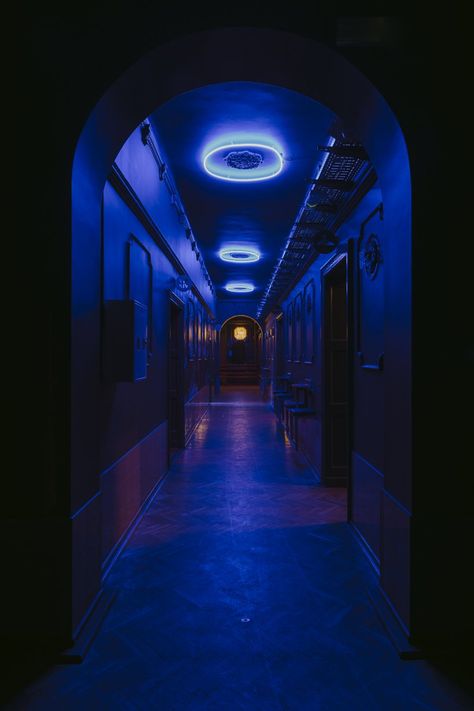 the existing 1930s building has been transformed into a mysterious and eclectic nightclub using contemporary shapes, colors and loud music. Ceramic Tile Colors, Oak Parquet Flooring, Nightclub Aesthetic, Nightclub Design, Vip Room, Blue Lights, New Retro Wave, Steel Frame Construction, Geometric Chandelier