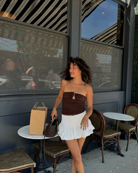 something new⋆˙⟡♡ @peppermayo Summer fashion, Casual chic, Outdoor café vibes, Minimalist style, White skirt outfit, Brown tube top, Strappy heels, Fashion inspiration, Natural curls, Sunlit afternoon, pinterest girl style, pinterest aesthetic #SummerStyle #EffortlessChic #StreetStyle #transitionalstyle #MinimalFashion #CurlyHair #CafeLife #styleinspiration #carriebradshawstyle #pinterestinspired Brown Skirt Outfit Summer, Style White Skirt, Brown Tube Top, Brown Skirt Outfit, White Skirt Outfit, Carrie Bradshaw Style, White Skirt Outfits, Skirt Outfit Summer, Style Pinterest