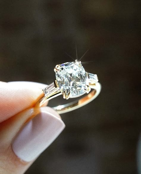 3CT Antique Inspired Elongated Cushion Cut Moissanite Diamond Engagement Ring | 10/14/18K Gold Side Baguette Cut Wedding Ring For Her ✥ Custom Order: * If you cannot find the piece your heart truly desires in my shop, I promise and guarantee that I can make it for you. Just send me a picture or an illustration, and I can start a conversation about your dream piece ✥ Stone Details: * Shape: Elongated Cushion Cut * Type: Moissanite Diamond * Weight: 3.0 CT (App.) * Size: 9.90 x 8.29 x 5.28 MM * Color: Colorless * Clarity: VVS ✥ Stone Details: * Shape: Baguette Cut  ✥ Metal Details: * In 925 Silver: * Yellow Gold Finish * Rose Gold Finish * White Gold Finish * In 10K/14k/18K Solid Gold: * Solid Yellow Gold * Solid Rose Gold * Solid White Gold ✥ Why buy Moissanite over Diamond? * Moissanite is Elongated Cushion Three Stone Engagement Ring, Side Baguette Engagement Ring, 2 Ct Elongated Cushion Engagement Ring, Double Claw Prong Engagement Ring, Antique Cushion Cut Engagement Ring, Antique Elongated Cushion Cut, Elongated Antique Cushion Cut, Three Stone Engagement Rings Vintage, Elongated Cushion Cut