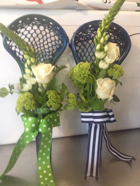 Lax Flower bouquet-  recycled lax heads with dollar store bubble bottles filled with oasis and flowers !! Lacrosse Stick Flower Bouquet, Lacrosse Bouquet, Lacrosse Centerpieces, Field Hockey Party, Lacrosse Senior Night, Lacrosse Decorations, Lacrosse Photos, Baseball Flowers, Graduation Display