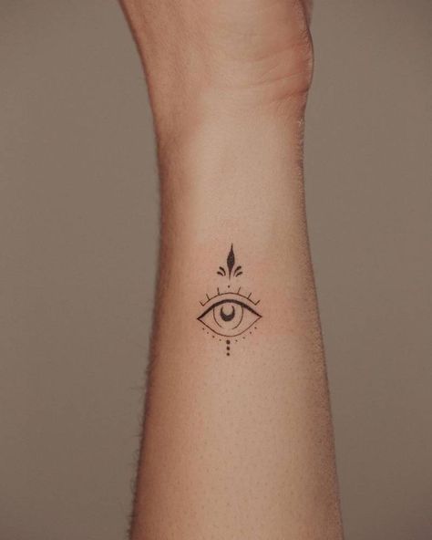 Small Tattoos Evil Eye, Evil Eye Forearm Tattoo, Tiny Tattoos Evil Eye, Minimalist Tattoo Evil Eye, Evil Eye With Moon Tattoo, Eye Fine Line Tattoo, Eye Tattoo Fine Line, Top Of Wrist Tattoos For Women, Delicate Evil Eye Tattoo