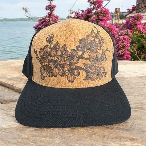 Burned Cork Hat using Pyrography techniques. Freehand burned making these Hats a One of A Kind. Cork is a natural water repellent. The burn actually gets darker when in the rain. Trucker Hats come with a signature market bag. Sakura Branch, Painted Hats, Velvet Hat, Market Bag, Custom Hats, Pyrography, In The Rain, Trucker Hats, Bridal Accessories