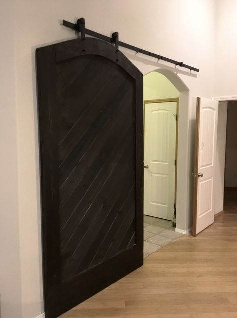 Sliding Barn Door Over Archway, Barn Door With Arched Doorway, Barn Door For Curved Doorway, Archway Sliding Door, Barn Door Over Arched Doorway, Covering Arched Doorway, Arched Barn Doors In The House, Arched Sliding Doors Interior, Door For Arched Doorway