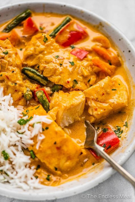 PIN TO SAVE! Thai fish curry is a 20 minute dinner recipe that tastes like a special treat. The fish is gently poached in a flavorful, coconut curry sauce that's bursting with delicious Thai flavors. You'll love it! #theendlessmeal #fishcurry #thaifishcurry #curry #fish #seafood #fishrecipe #thairecipes #easyreacipes #easymeals #curryrecipe #thai #greencurry #redcurry Tilapia Curry, Thai Fish Curry, Thai Flavors, Curry Easy, Thai Curry Recipes, Curry Fish, Thai Fish, Recipes Fish, Fish Curry Recipe