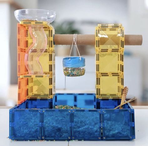 Magnetic tile build with a cardboard roll and string to pull up rice in a pulley. Fun for kids. Block Activities, Simple Machine Projects, Connetix Tiles, Sensory Rice, Diy Sensory, Rainbow Rice, Tiles Ideas, Cardboard Toys, Magnetic Tiles