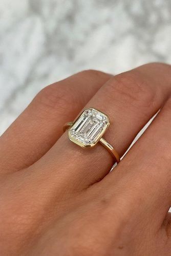 Eye-Catching Emerald Cut Engagement Rings ★ emerald cut engagement rings gold simple classic diamond Wide Emerald Cut Engagement Ring, Emerald Round Engagement Ring, Wedding Rings Bezel, Bevel Emerald Cut Engagement Ring, Unique Emerald Cut Engagement Rings Gold, Simple Gold Engagement Rings Vintage, Rounded Emerald Cut Engagement Ring, Unique Engagement Rings Emerald Cut, Bezel Set Engagement Ring Emerald