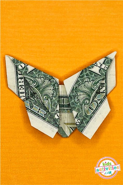 Beautiful and Easy Dollar Bill Origami Butterfly | Kids Activities Blog Dollar Bill Origami Butterfly Easy, Origami Dollar Bill Easy Step By Step, How To Make A Butterfly Out Of Money, Butterfly Dollar Bill, Folding Dollars Into Shapes, Origami Dollar Bill Easy, Folded Dollar Bills Easy, Folding Dollar Bills Easy Step By Step, Dollar Bill Butterfly