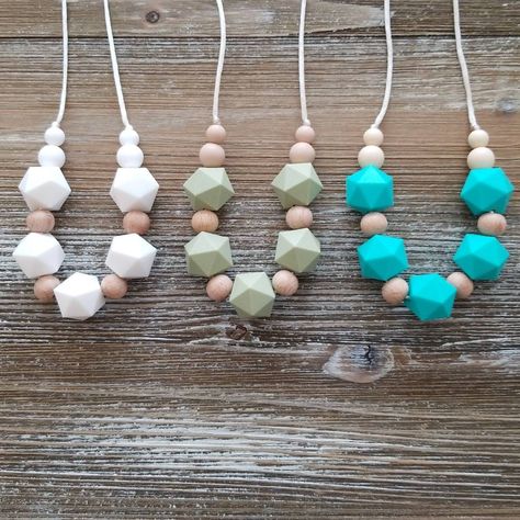 These lightweight nursing necklaces are fun for twiddling fingers and stylish enough to go with any outfit! Made with high quality silicone beads, unfinished wood beads,  silky poly cord, and breakaway clasp. BPA free , paraben free, phthalate free, heavy metal free.  Easy clean with damp cloth. We commend washing silicone beads and pretreating the wood beads with organic olive or coconut oil or all natural wax before use. Like all high quality wood, the raw wood beads need to be treated at leas Wood Beads Jewelry, Breastfeeding Necklace, Silicone Necklace, Nursing Necklace, Natural Wax, Raw Wood, Bead Jewelry, Silicone Beads, Unfinished Wood