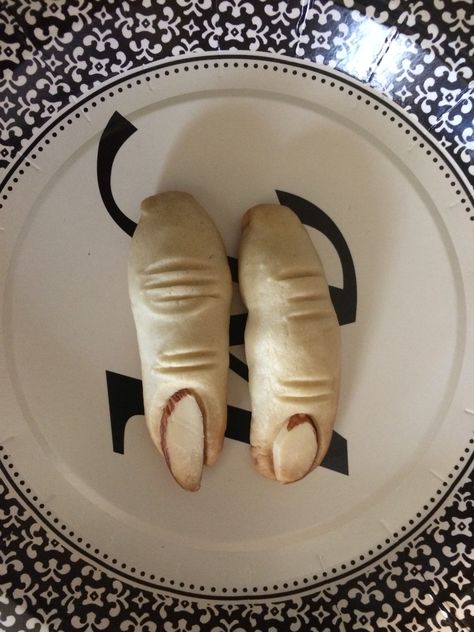 Severed zombie finger cookies with slivered almond "fingernails." Happy Halloween! Halloween Cookie Fingers, Severed Finger Cookies, Garlic Bread Skeleton Meme, Black And White Designs, Finger Cookies, Almond Nail, White Plate, White Plates, Random Pics