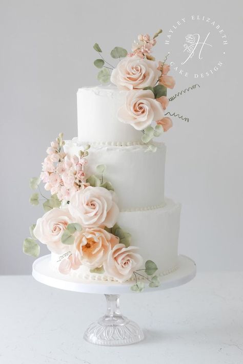 Peach wedding | White wedding cake with peach flowers | Blush peach wedding | Luxury wedding cake designs | Elegant wedding cakes | hampshire cake designer | Wedding cake designer | Luxury cake designer | pretty sugar flower wedding cake | Wedding cakes inspiration Wedding Cake Peach Flowers, Flower Wedding Cakes, Wedding Cake Luxury, Peach And White Wedding, Cake Luxury, Blush Pink Wedding Cake, Wedding Cake Designs Elegant, Peach Pink Wedding, Sugar Flower Wedding Cake