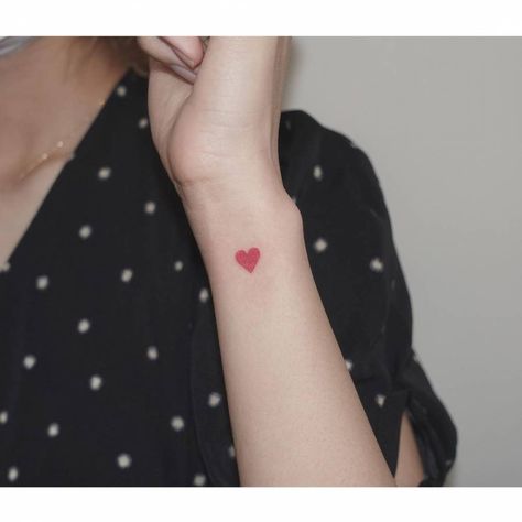 Minimalist red heart tattoo on the wrist. Red Heart Tattoo, Tattoo On The Wrist, Heart Tattoo On Finger, Love Heart Tattoo, Heart Minimalist, Heart Tattoo Wrist, Red Heart Tattoos, Tiny Heart Tattoos, Tattoo Heart