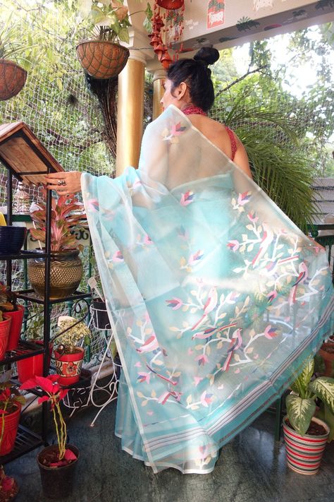 A splendid turquoise colour Muslin jamdani saree. The saree is subtle, lightweight and comes with the beauty which is hard to describe. You can check the intricate jamdani work on the pallu. It has birds with flowers. A subtle and precise saree which is very easy to handle. #silk #muslin #silkmuslinjamdani #muslinjamdani #jamdanimuslin #saree #Sotd #weavesofindia #savetheweaves #indianwedding #indianwear #ethnicwear #handloomweaves #traditional Purple Jamdani Saree, Muslin Jamdani Saree, Birds With Flowers, Muslin Saree, Indian Handloom, Turquoise Colour, Saree Design, Indian Bridal Dress, Jamdani Saree