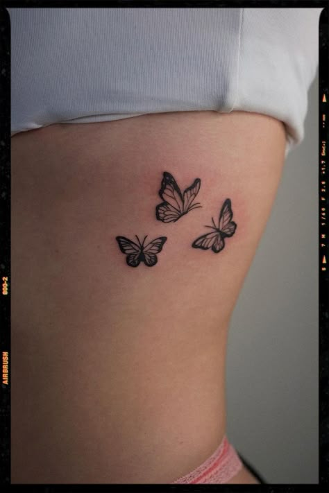 Baddie Tattoos Inspiration 3 Different Butterflies Tattoo, Butterfly Tattoo On Rib Cage, Rib Tattoo Ideas Female, Baddie Tattoo Ideas Female, Baddie Tattoo Ideas, Baddie Spine Tattoo, Baddie Tattoos, Harry Tattoos, Rib Tattoos For Women