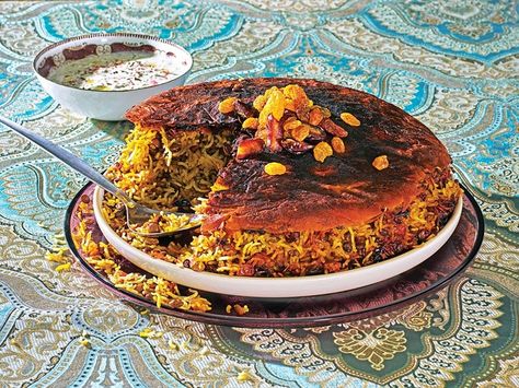 In this traditional Persian rice dish, extra-long basmati rice is tossed with tender lentils, warming spices, and buttered dried fruit. A crispy layer of lavash protects the rich fruit from scorching in the pot. Adas Polo, Persian Food Recipes, Tahdig Recipe, Herbed Rice, Lentil Rice, Veal Stew, Persian Rice, Persian Cuisine, Lamb Meatballs