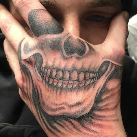 Mouth Hand Tattoos For Guys, Skull Face On Hand Tattoo, Hand Tattoos Face Mask, Hand Tattoos For Guys Skull, Mens Skeleton Hand Tattoo, Skeleton Mouth Hand Tattoo, Skeleton Face Hand Tattoos, Hand Face Tattoos, Smile Tattoo On Hand