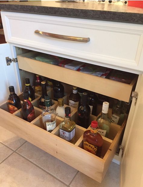 Great way to store your liquor bottles and see them all at once, with out them getting shoved to the back of a shelf or above the cabinet of your refrigerator! Cabinet Above Refrigerator, Above Refrigerator, Liquor Storage, Kitchen Bar Design, Home Wet Bar, Basement Bar Designs, Built In Bar, Bar Designs, Bar Storage