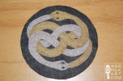 Book Nook:The Never Ending Story - AURYN Medallion | Wee Folk Art Folk Art Applique, Snake Rug, Norse Patterns, Tattoo Collage, Wee Folk Art, The Never Ending Story, Free Applique Patterns, Geeky Craft, Appliqué Patterns