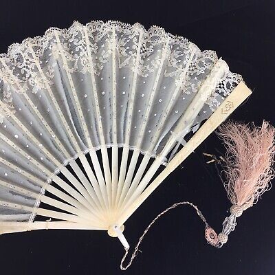 The previous owner was a serious collector of fans from all over the world. The collector identifies this one as a wedding fan made from lace and wood. The minute white sequins with woven white thread serve to highlight the simplicity of the lace background. Wedding Fan, Lace Background, Fancy Hands, Folding Hand Fan, Wedding Fans, Vintage Fans, Hand Fans, Victorian Steampunk, Wood Wedding