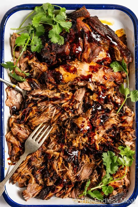 Win over the whole family with this flavor-packed Korean pulled pork. The meat slowly cooks away for hours, soaking up ALL the flavor from a delicious marinade of Korean gochujang, soy sauce, honey, and chicken stock. The best part: it's super easy thanks to the slow cooker. This succulent, melt-in-your-mouth masterpiece practically cooks itself! #theendlessmeal #pulledpork #crockpot #slowcooker #gochujang #korean #koreanpork #crockpotpork #porkrecipes #crockpotrecipes #koreanpulledpork #pork Asian Pork Crockpot Recipes, Korean Pulled Pork Slow Cooker, Korean Bbq Pulled Pork, Korean Pulled Pork, Korean Bbq Pork, Pulled Pork Slow Cooker, Recipe For Pulled Pork, Pulled Pork Dinner, Pork Slow Cooker