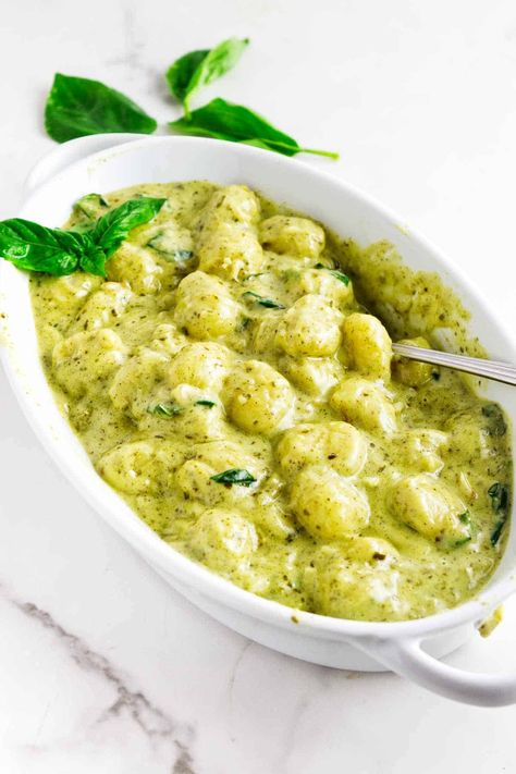 Creamy Pesto Gnocchi is a quick and easy single pan side dish. Fresh basil pesto, heavy cream, and Parmesan cheese come together to create a luxurious and satisfying sauce that perfectly complements the soft gnocchi. Pesto Cream Gnocchi, Gnocchi Pesto Cream Sauce, Creamy Pesto Gnocchi Recipes, Basil Gnocchi Recipes, Frozen Casserole Recipes, Creamy Pesto Gnocchi, Pesto Cream Sauce, Gnocchi Pesto, Pesto Gnocchi