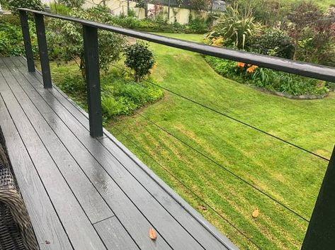 Black balustrade wires running through in-line posts Black Balustrade, Wire Balustrade, Truro Cornwall, Decking Area, Timber Deck, Truro, Cornwall, New Black, Balcony