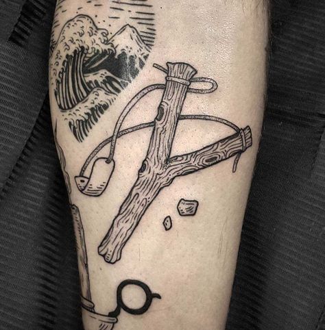 Share it: Share it: Slingshot Tattoo, Eve Tattoo, Related Tattoos, Aesthetic Tattoos, Cute Tats, Sling Shot, Old School Tattoo Designs, Tattoo Desings, Best Sleeve Tattoos