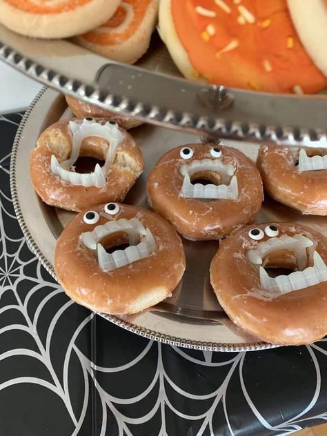 Donuts With Dracula Teeth, Spirit Halloween Birthday Party, Donut Vampire Teeth, Donuts With Vampire Teeth, Dental Dessert Ideas, Vampire Party Snacks, Vampire Donuts Halloween, Two Spooky 2nd Birthday Party Food, October Birthday Food Ideas