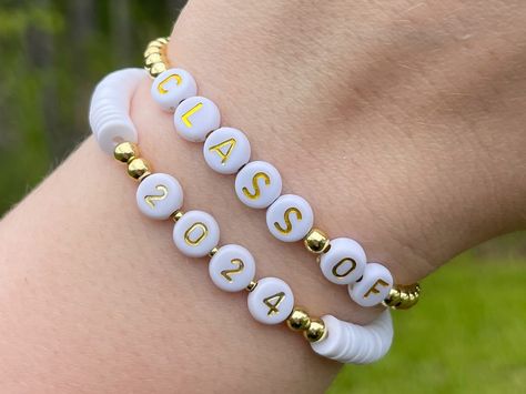 Celebrate your grad this graduation season! 🎓🤍 #handmadejewelry #handmadebracelet #beadbracelet #beadedbracelet #heishibeads #heishibracelets #classof2024 #seniorgift #seniorbracelet #graduationbracelet #graduationgift #gradgift #gradbracelet #2024senior #2024grad Graduation Bracelet, Graduation Jewelry, Set Bracelet, Senior Gifts, Clay Bracelet, Diy Bracelet Designs, Class Of 2024, Grad Gifts, Heishi Beads