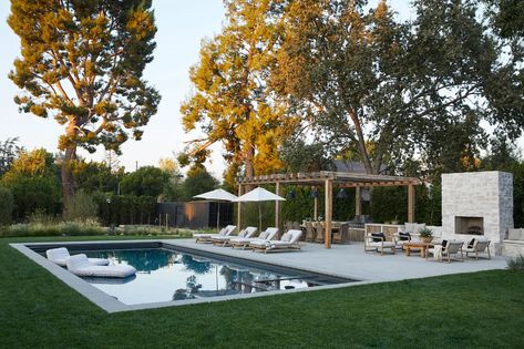 Tour Top Designer Amber Lewis’s Megawatt “Kardashian Country” Digs | Architectural Digest Woodland Hills California, Black Paint Color, Wood Garage Doors, Black Front Doors, Amber Lewis, West Coast Fashion, Casa Exterior, Woodland Hills, Amber Interiors