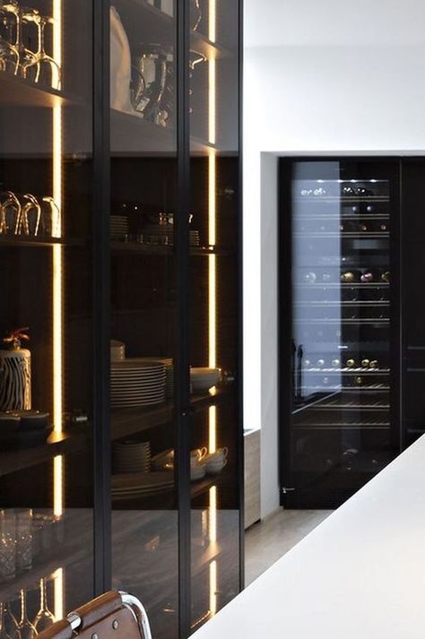 lit up smoke glass kitchen cabinets are ideal for masculine or minimalist spaces and look edgy Kitchen Appliances Black, Black Cupboards, In Home Theater, Black Kitchen Cabinet, Black Appliances Kitchen, Glass Kitchen Cabinets, Glass Cupboard, Modern Kitchen Interiors, Kitchen Concepts