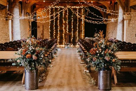 The Tythe Barn wedding ceremony room with fairy lights, milk churn florals and rustic wedding decor. Wedding With Fairy Lights, Barn Rustic Wedding, Sage Green Bridesmaid Dresses, Sage Green Bridesmaid, Autumn Wedding Inspiration, Fairy Lights Wedding, Fall Barn Wedding, Wedding Isles, Sage Green Bridesmaid Dress