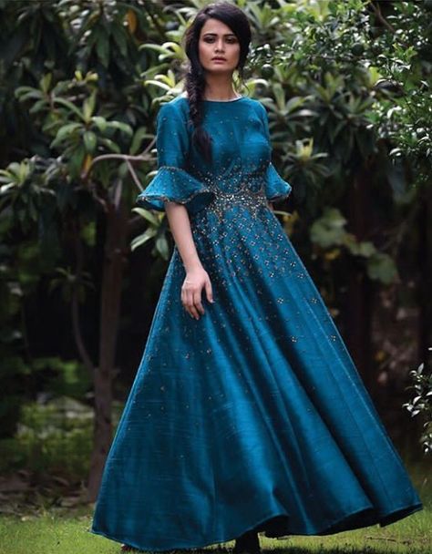 Beautiful Silk Anarkali Gown.  Embellished with hand embroidery.  Modern bell cuff sleeves.  Shine and glitter perfect for wedding seasons and festivals.  #Anarkali #Dress #silhouettes #indowestern #Gown #irrauofficial #Embroidery #traditional Bell Hands, Flared Tops, Silk Anarkali Gown, Indowestern Gown, Kurti Long, Wedding Seasons, Indowestern Gowns, Frock Models, Embroidery Traditional