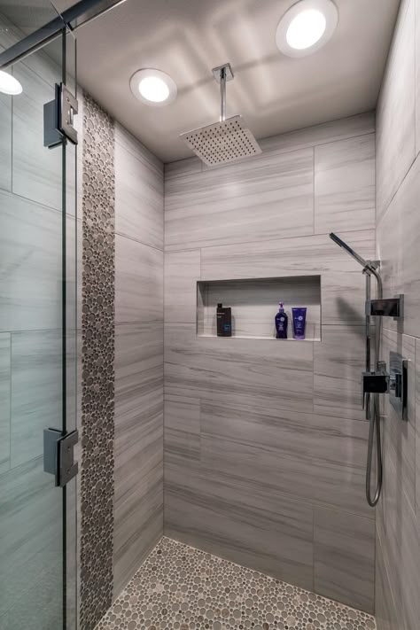 Round tiles give a pebbled look and feel to this stylish walk-in shower with a luxurious waterfall shower head. Modern Shower Design, Modern Shower Room, Design Tiles, Bathroom Shower Design, Shower Bathroom, Luxury Shower, Bathroom Tile Designs, Bathroom Shower Tile, Bathroom Remodel Shower