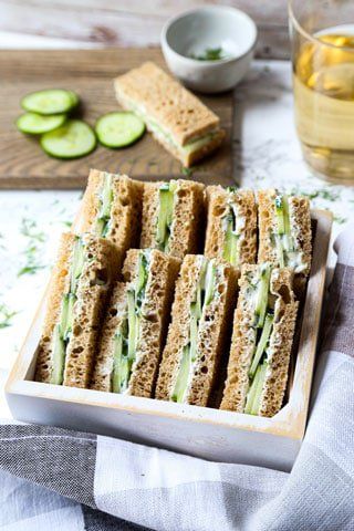 I've dressed up these cucumber sandwiches with tzatziki, a classic Southeast European dip made with Greek yogurt, dill, and extra virgin olive oil. The combination of crunchy cucumber and cooling yogurt spread make these tea sandwiches Yogurt Spread, English Tea Sandwiches, Cucumber Sandwiches Recipes, Cucumber Sandwich, Cucumber Tea Sandwiches, Tzatziki Sauce Recipe, Sandwich Fillers, Cucumber Bites, Mapo Tofu