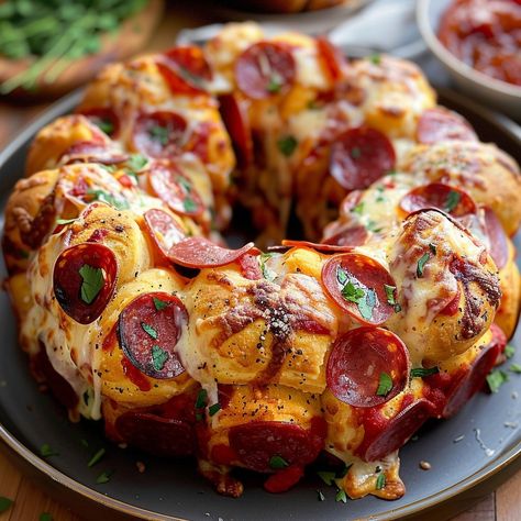 Perfect for your next party or a fun family dinner! Pepperoni Pizza Monkey Bread Visit website for full recipe at https://northeastnosh.com/f/pepperoni-pizza-monkey-bread #northeastnosh #pizzabread #cheesybread #pepperonibread #monkeybread #easyrecipes #partyfood #comfortfood #bakingfun #cheesdlovers #pepperoni #italiancuisine #homemadepizza #appetizers #snacktime #homecooking #recipes #pizzarecipes Bread Pretzels, Pizza Monkey Bread Recipe, Pepperoni Pizza Monkey Bread, Cannoli Cookies Recipe, Pizza Monkey Bread, Monkey Bread Recipe, Cheese Burger, Pizza Recipes Homemade, Recipes Appetizers And Snacks